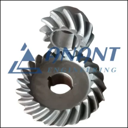 A close-up image of Anant Engineering's straight and spiral bevel gears used in mechanical systems.